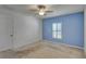 Spacious bedroom with neutral carpeting and ceiling fan at 9355 Westmorely St, Groveland, FL 34736