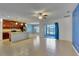 Open concept kitchen with island and stainless steel appliances at 9355 Westmorely St, Groveland, FL 34736