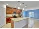 Modern kitchen with granite countertops and wood cabinets at 9355 Westmorely St, Groveland, FL 34736