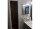 Clean bathroom with a vanity and mirrored medicine cabinet at 134 W America St # 29, Orlando, FL 32801