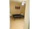 Simple bedroom with tile floors and window at 134 W America St # 29, Orlando, FL 32801
