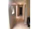 Long hallway with light walls and tile floors at 134 W America St # 29, Orlando, FL 32801