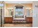 Spa-like bathroom with double sinks, soaking tub, and walk-in shower at 13632 Paytons Way, Orlando, FL 32828