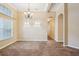 Formal dining room with tile floors and chandelier at 13632 Paytons Way, Orlando, FL 32828