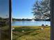 Lake view from backyard with birds and playground at 14112 Morning Frost Dr, Orlando, FL 32828