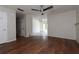 Spacious living room featuring hardwood floors, neutral walls and multiple doorways leading to other spaces at 1603 Doreen Ave, Ocoee, FL 34761