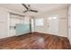 Spacious living area with wood flooring, a ceiling fan, and natural light from the window at 1603 Doreen Ave, Ocoee, FL 34761