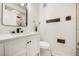 Modern bathroom with white vanity, marble shower, and black accents at 1651 Common Way Rd, Orlando, FL 32814