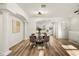 Bright dining room with a round glass table and four cushioned chairs at 1651 Common Way Rd, Orlando, FL 32814