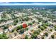 Expansive aerial view of a residential neighborhood with mature trees and clear blue skies at 2341 Hadley St, Deltona, FL 32738