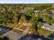 Aerial view of a residential neighborhood with mature trees and well-maintained lawns at 2341 Hadley St, Deltona, FL 32738