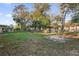 Large backyard with grassy area and trees at 2341 Hadley St, Deltona, FL 32738