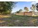 Backyard view of house with grassy area at 2341 Hadley St, Deltona, FL 32738