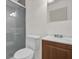 Clean bathroom with shower, toilet and wood vanity at 2341 Hadley St, Deltona, FL 32738
