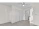 Bright bedroom with a ceiling fan, closet, tile floors, and an ensuite bathroom at 2341 Hadley St, Deltona, FL 32738