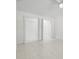 Bright bedroom boasts two large closets and tiled floor at 2341 Hadley St, Deltona, FL 32738