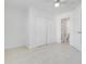 Bedroom featuring tile floors, closet, and attached bathroom at 2341 Hadley St, Deltona, FL 32738