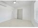 Bright bedroom with tile flooring, ceiling fan, and closet access at 2341 Hadley St, Deltona, FL 32738