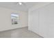 Well-lit bedroom, featuring a window and double door closet at 2341 Hadley St, Deltona, FL 32738