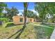 Lovely single-story home featuring a tidy yard, mature trees, and a welcoming front entrance at 2341 Hadley St, Deltona, FL 32738