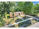 Charming single-story home with a well-manicured lawn and mature landscaping at 2341 Hadley St, Deltona, FL 32738