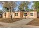 Charming single-story home with a well-maintained lawn and a classic stucco exterior at 2341 Hadley St, Deltona, FL 32738