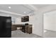 Well-equipped kitchen, boasting dark cabinetry and tile floors at 2341 Hadley St, Deltona, FL 32738