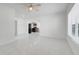 Open-concept living room with tiled floors, leading into updated kitchen at 2341 Hadley St, Deltona, FL 32738