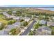 Aerial view of homes and landscape with lake in background at 2510 Black Lake Blvd, Winter Garden, FL 34787