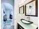 Stylish bathroom features glass vessel sink and view of living area at 2510 Black Lake Blvd, Winter Garden, FL 34787
