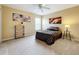 Cozy bedroom with carpeted floor, ceiling fan, and ample space at 2510 Black Lake Blvd, Winter Garden, FL 34787