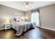 Spacious bedroom with hardwood floors, ceiling fan and large window at 2510 Black Lake Blvd, Winter Garden, FL 34787