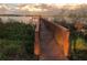 Wooden dock extending over calm lake waters at sunset at 2510 Black Lake Blvd, Winter Garden, FL 34787