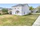 Two-story house rear view, screened lanai, and backyard at 2510 Black Lake Blvd, Winter Garden, FL 34787