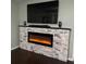 Elegant living room featuring a modern electric fireplace and built-in media console at 2510 Black Lake Blvd, Winter Garden, FL 34787