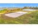 Beach volleyball court with sand surface next to a lake at 2510 Black Lake Blvd, Winter Garden, FL 34787