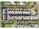 Townhome community showcases well-maintained exteriors, ample parking, and proximity to community pool at 607 Pensacola Ln, Lake Mary, FL 32746