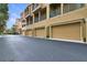 Townhomes with attached garages, private balconies, and well-manicured landscaping at 607 Pensacola Ln, Lake Mary, FL 32746