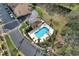 Inviting community pool surrounded by mature trees, providing a relaxing retreat at 607 Pensacola Ln, Lake Mary, FL 32746
