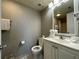 Clean bathroom with a single sink vanity and shower at 6165 Carrier Dr # 2401, Orlando, FL 32819