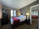 Comfortable bedroom with a king-size bed and a flat-screen TV at 6165 Carrier Dr # 2401, Orlando, FL 32819