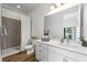 Modern bathroom with white vanity and walk-in shower at 66 W Harding St # B, Orlando, FL 32806