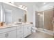 Modern bathroom with double vanity and large shower at 66 W Harding St # B, Orlando, FL 32806