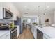 Modern kitchen with stainless steel appliances and white cabinetry at 66 W Harding St # B, Orlando, FL 32806