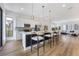 Open concept kitchen with island and stainless steel appliances at 66 W Harding St # B, Orlando, FL 32806