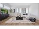 Living room with sectional sofa and large TV at 66 W Harding St # B, Orlando, FL 32806
