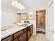Elegant bathroom with granite countertops and a walk-in shower at 8851 Geneve Ct, Kissimmee, FL 34747