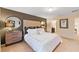 Spacious bedroom with a plush bed and accent wall at 8851 Geneve Ct, Kissimmee, FL 34747