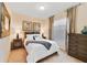 Cozy bedroom with a full-size bed and built-in dresser at 8851 Geneve Ct, Kissimmee, FL 34747