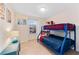 Charming bedroom with a bunk bed, perfect for  at 8851 Geneve Ct, Kissimmee, FL 34747